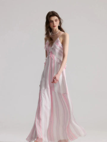 A French-style slip dress with pink and white stripes and ruffle details